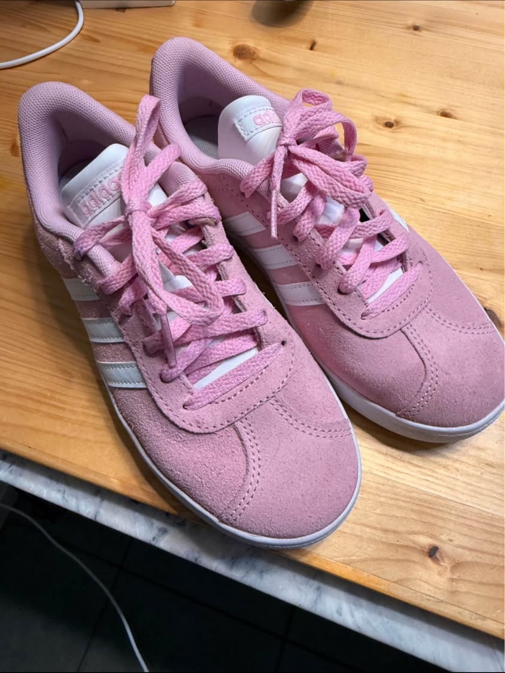 Adidas VL Court 3.0 shoe in pink suede with white stripes.